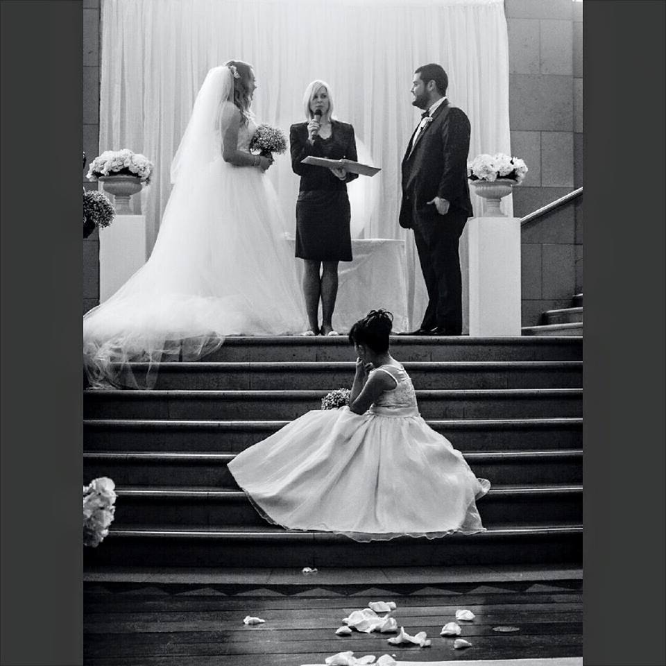 A flower girl's quiet moment on the chapel steps