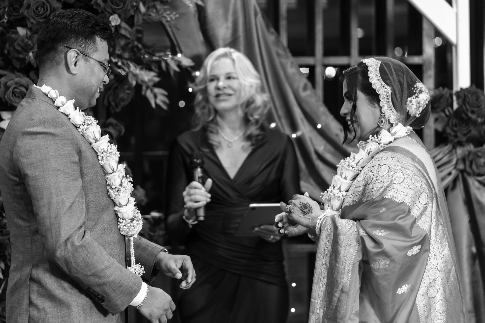Nicole Webster smiling as the couple exchange vows