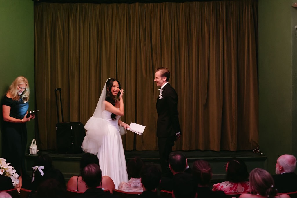 A light-hearted moment as the bride reads her vows