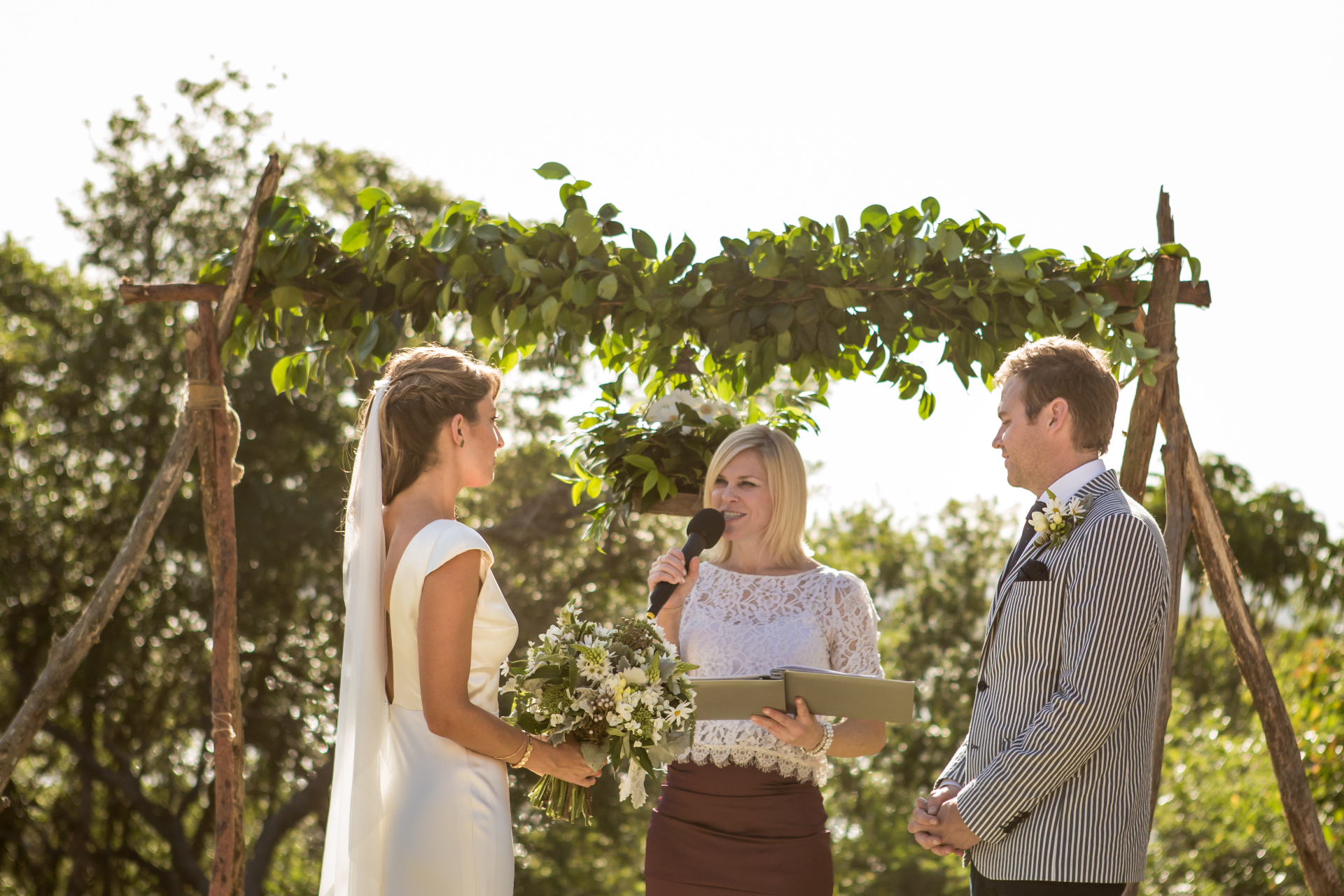 Vows beneath the vineyard arch