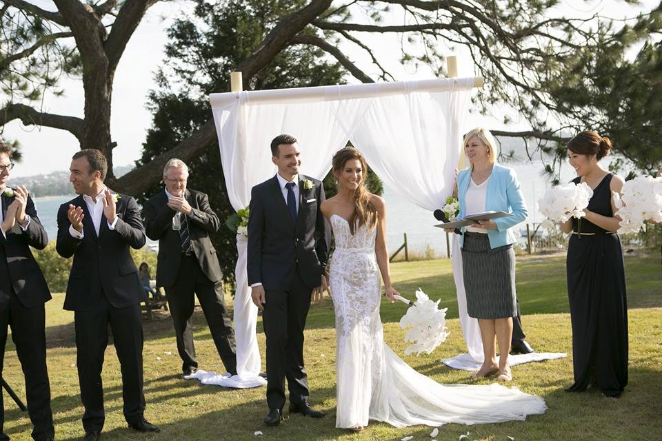 Just married, beneath the harbour arch