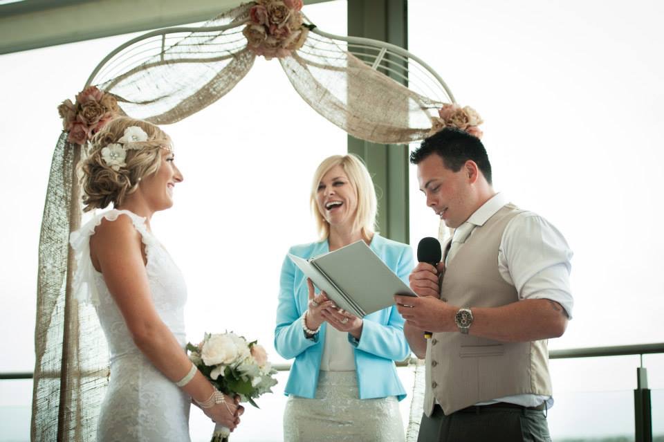A moment of laughter under the burlap arch