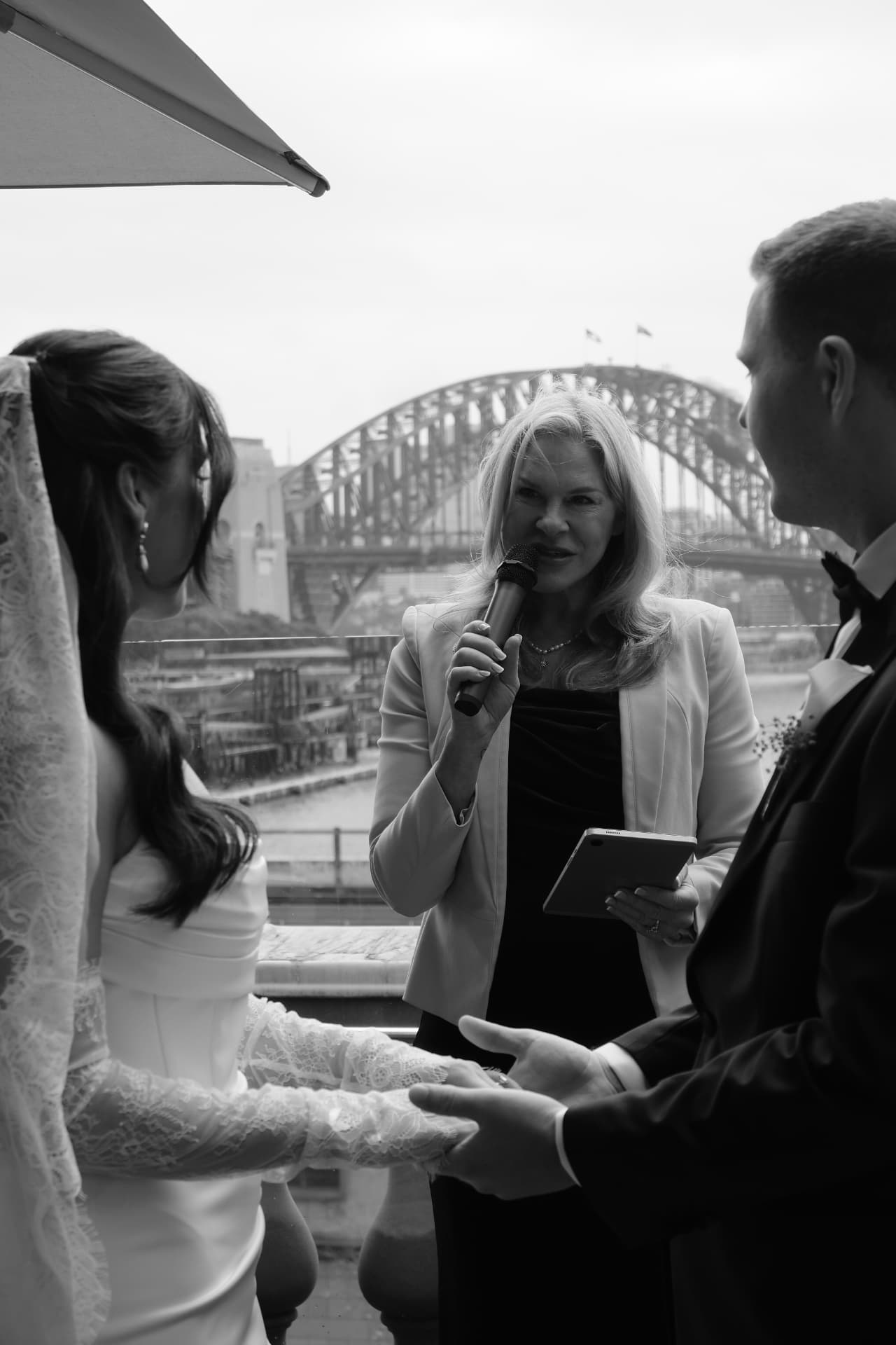 Nicole leading the vows, Harbour Bridge behind