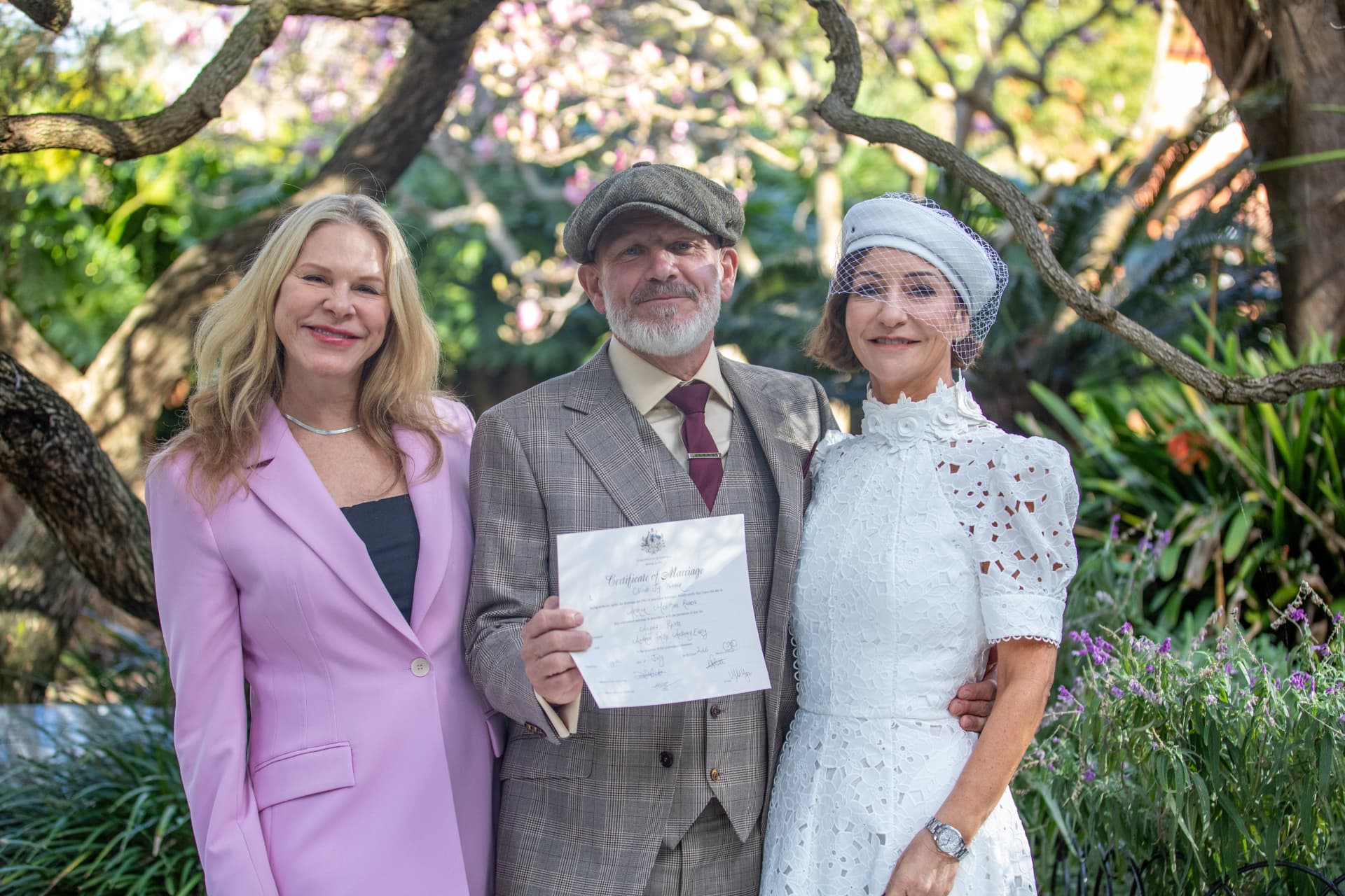 Nicole with the newlyweds and their Certificate of Marriage