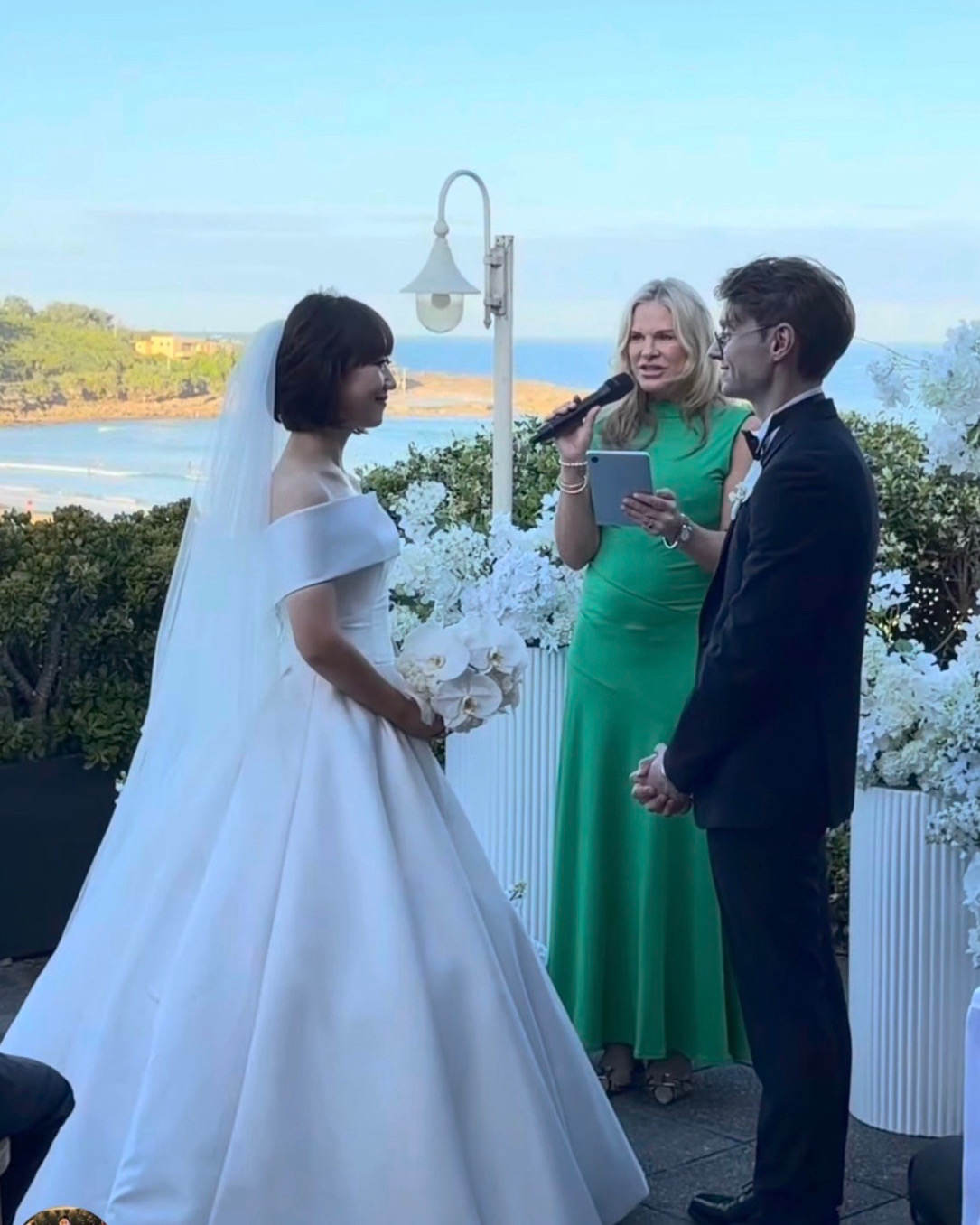 Golden-hour coastal terrace vows