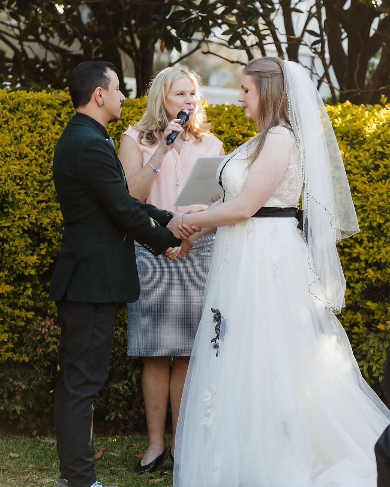 Holding hands through the vows